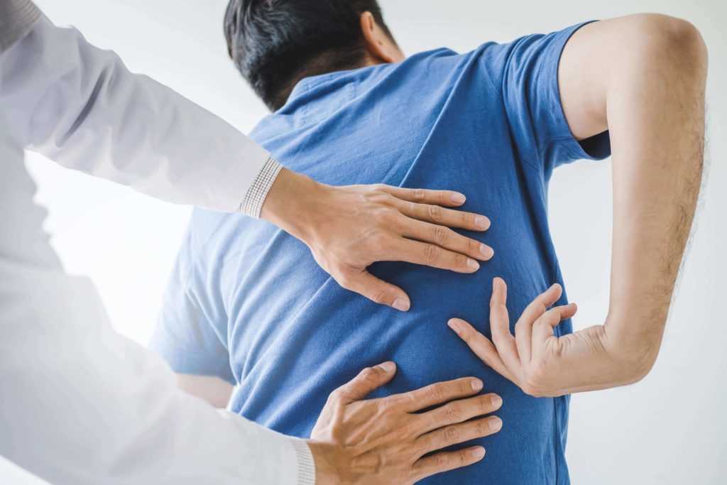 man in physical therapy for low back pain