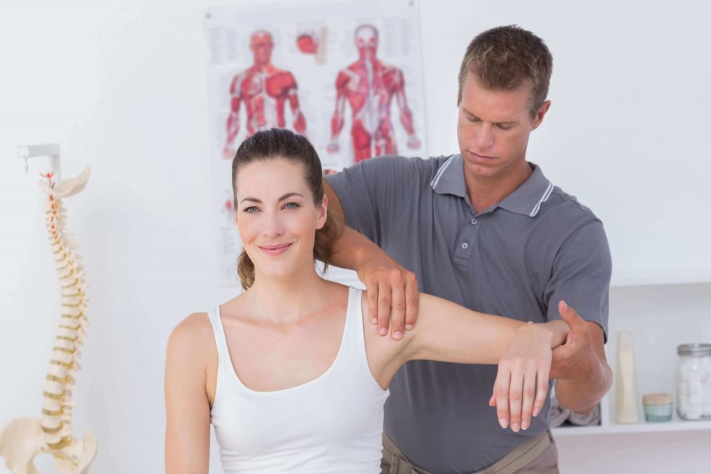 woman in physical therapy for neck pain
