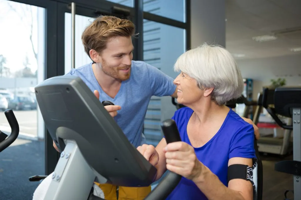 woman in blood flow restriction therapy with physical therapist