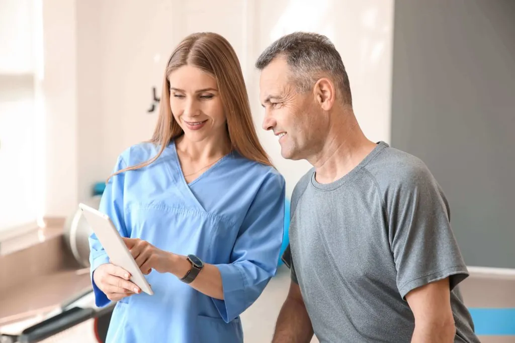 patient asking a physical therapist questions