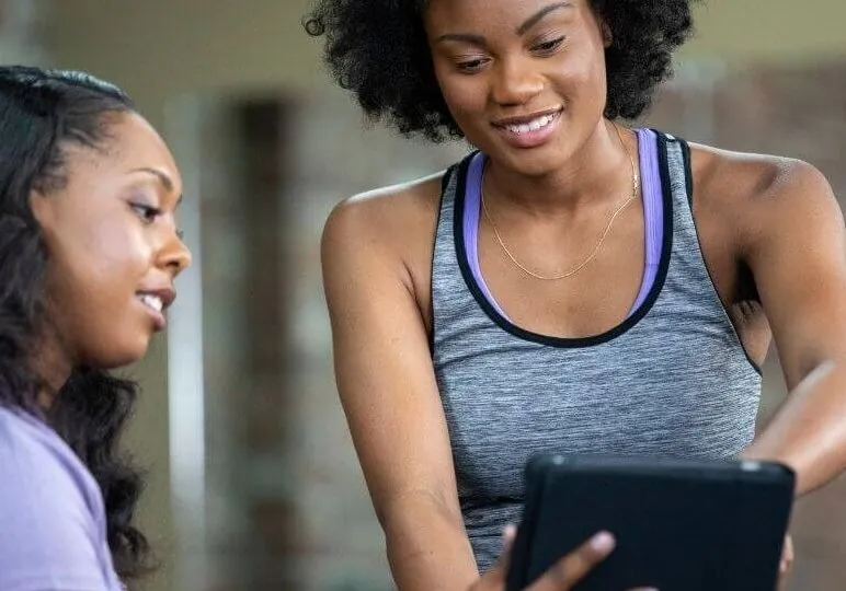 PT reviewing diagnostic with sitting patient 2 square right aligned